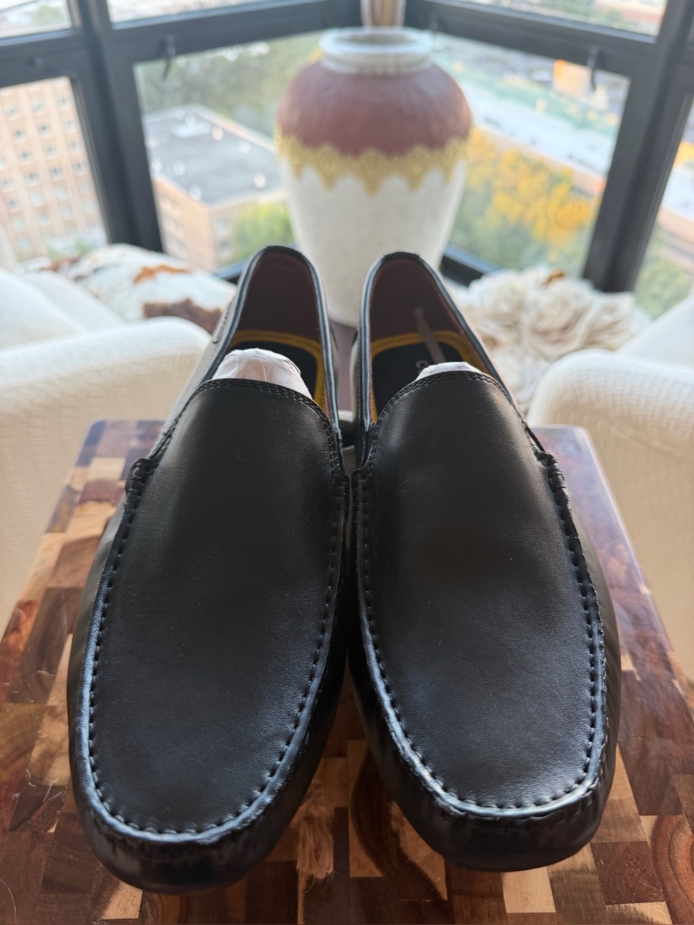 Classic Men's Black Leather Slip-On Loafers by Cole Haan.